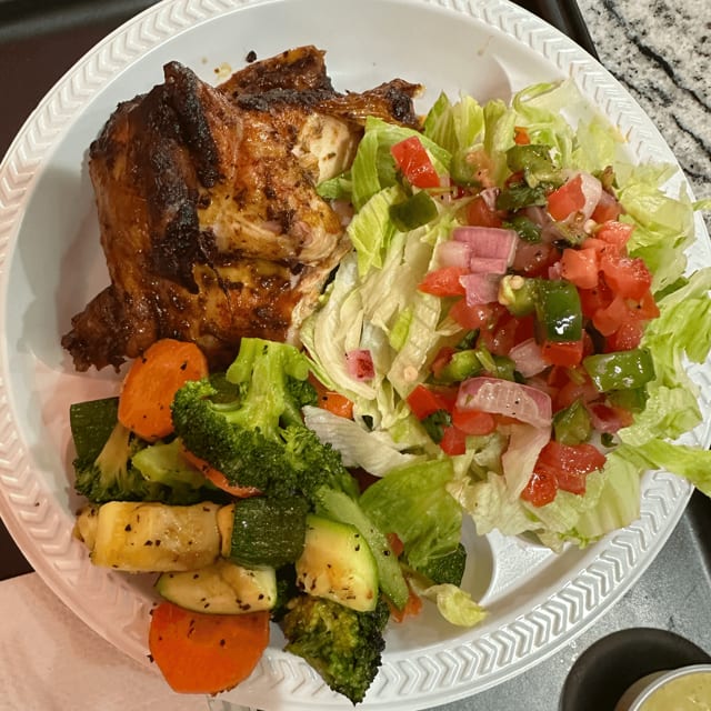 1/2 Chicken Served With 2 Side Order.
